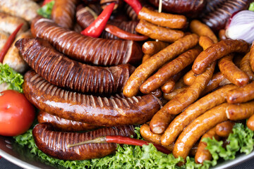 delicious grilled sausages with salad and vegetables