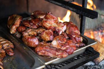 tasty meat smokes on the grill