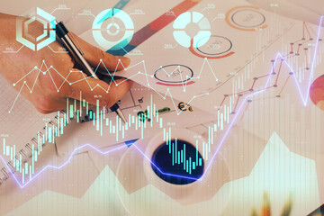 Multi exposure of man planing investment with stock market forex chart.