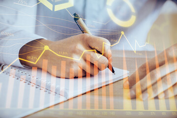 Multi exposure of man planing investment with stock market forex chart.