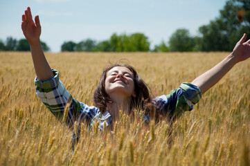 Beauty Girl enjoying outdoor. Outstretched arms fresh morning air summer at sunrise. unity of human...