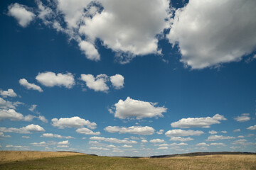 beautiful photo of blue sky with clouds and field in Ukraine