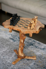 Wooden chess table. Eco house. Competition concept