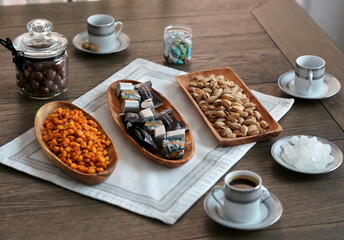 Arabic coffee and snacks on wooden plates. Eco concept. Natural materials for home.
