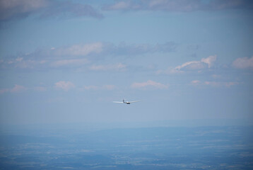 Fototapeta na wymiar Glider plane flying in the sky. Two seat glider just before landing