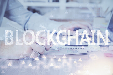 Blockchain theme hud with businessman working on computer on background. Concept of crypto chain....