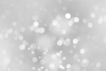 Obraz na płótnie Canvas White glitter vintage lights background. White bokeh on black background.