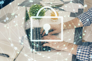 Multi exposure of lock icon with man working on computer on background. Concept of network protection.