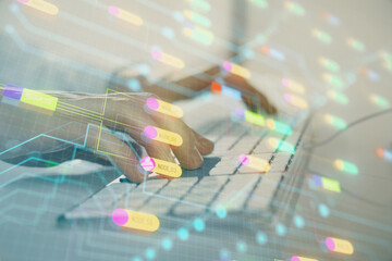 Double exposure of data internet theme hologram with man working on computer on background. Concept...