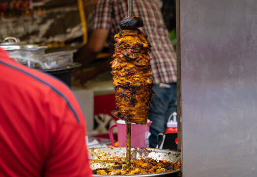 Chicken Grilled In A Rotating Skewer To Serve A Middle Eastern Food Called Shawarma