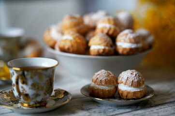 cup of tea and profiterols