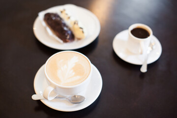 A mug of fragrant cappuccino brought by the waiter