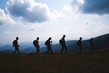 group of people in the mountains silhouette
