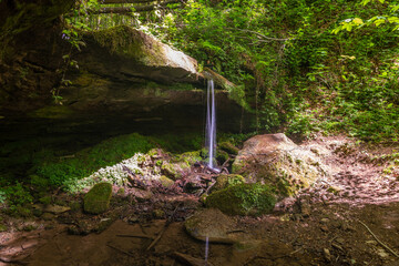 Water flowing over moss covered rocks