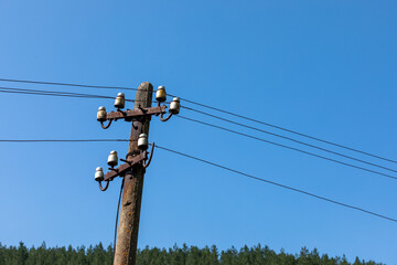 Old concrete pillar with electricity.