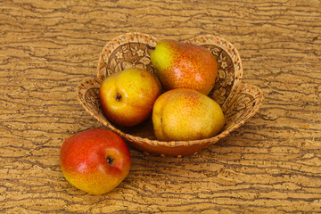 Pear heap in the wooden basket