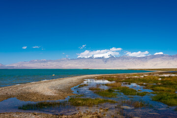 Karakul Lake in Gorno-Badakhshan, Tajikistan. It is located in the World Heritage Site Tajik National Park (Mountains of the Pamirs).