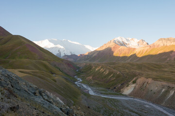 Morning Sunlight Landscape of Lenin Peak (7134m) at Alay Valley in Osh, Kyrgyzstan. Pamir mountains in Kyrgyzstan.