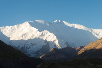 Morning Sunlight Landscape of Lenin Peak (7134m) in Osh, Kyrgyzstan. Pamir mountains in Kyrgyzstan.