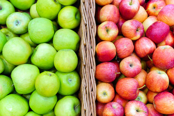 Variety of colorful fresh fruits red apple, green apple on the local market shelf