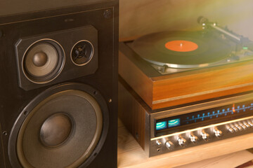HiFi system with turntable, amplifier, headphones and lp vinyl records in a listening room
