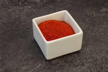 Dry paprika powder in the bowl