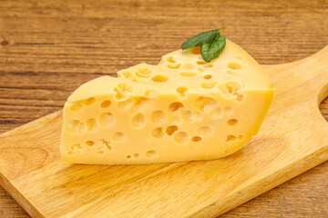 Maasdam cheese - yellow triangle with holes