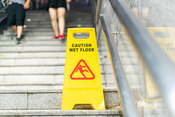 "Caution wet floor" sign in stairs