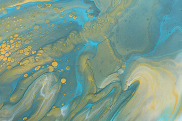 art photography of abstract marbleized effect background. Blue, green and gold creative colors. Beautiful paint.