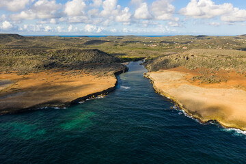 Aerial view of coast of Curaçao in Caribbean Sea with turquoise water, cliff and beautiful coral...