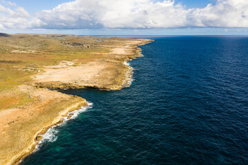 Fototapeta na wymiar Aerial view of coast of Curaçao in Caribbean Sea with turquoise water, cliff and beautiful coral reef