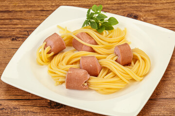 Kids pasta spaghetti with sausages