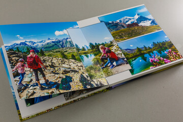 open photo book on a gray background