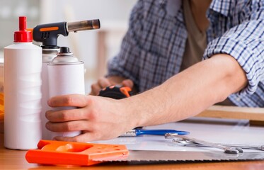 Young man in woodworking hobby concept