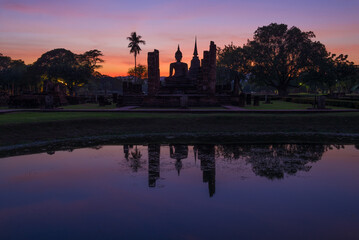 The ruins of the Buddhist temple Wat Chana Songkram against the backdrop of an outgoing sunset. Sukhothai. Thailand