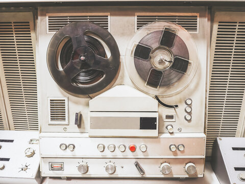 Old soviet white bobbin tape recorder. Retro museum exhibit