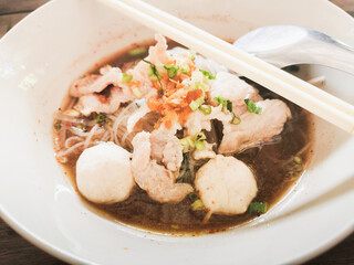 thai style spicy pork noodle with meatball