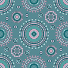 Seamless symmetric pattern of circles and dots of blue, pink and violet colors.