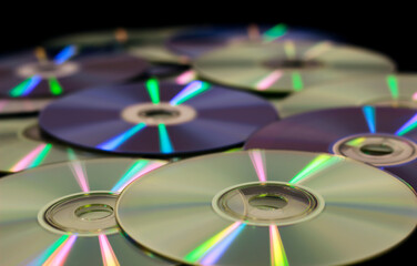 Stack of CDs and Diskettes spread over ground