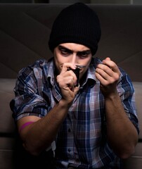 Young man in agony having problems with narcotics