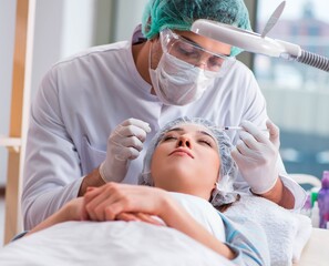 Obraz na płótnie Canvas Woman visiting doctor for plastic surgery