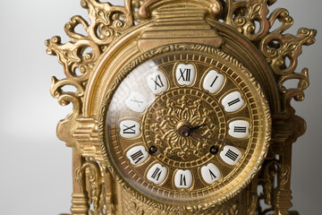 Fototapeta na wymiar dial of vintage bronze clock, antique clock photo close up, old bronze clock in gilding, front of bronze fireplace clock, 