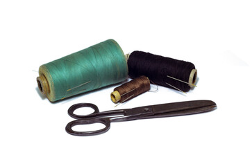 sewing spools with an old style scissors