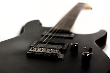 Fototapeta na wymiar Black 6-string Electric Guitar / Isolated Background