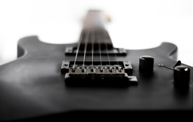 Fototapeta na wymiar Black 6-string Electric Guitar / Isolated Background / Symmetric shot