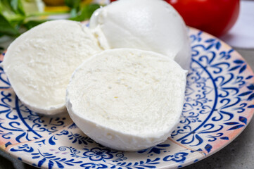 Fresh handmade soft Italian cheese from Campania, white balls of buffalo mozzarella cheese made from cow milk ready to eat