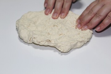 Woman kneading dough