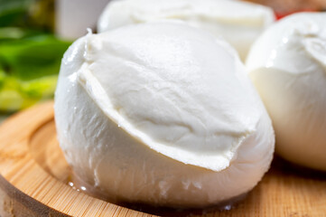 Fresh handmade soft Italian cheese from Campania, white balls of buffalo mozzarella cheese made from cow milk ready to eat