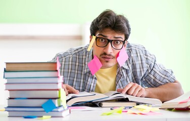 Student preparing for university exams with many conflicting pri