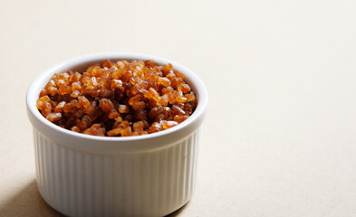 Bowl of Crystal Sugar. Brown cane sugar.